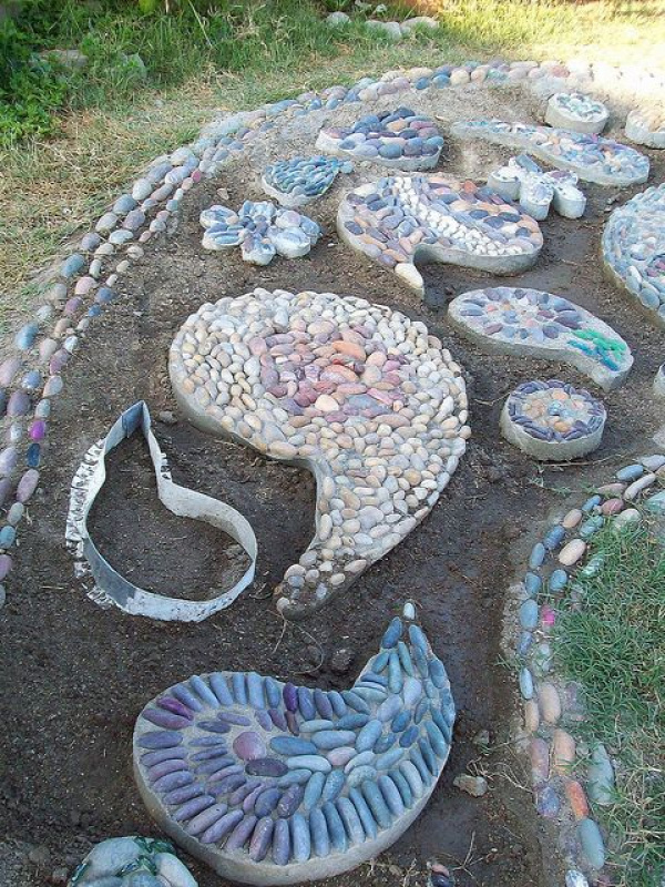 Pebble Mosaic walkway in progress - also has bed borders and garden glass flowers from plates in the photo stream.