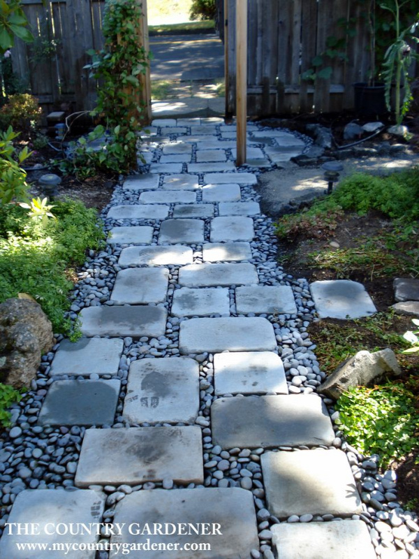 An inexpensive option for a beautiful path. Flagstones and river rock garden path