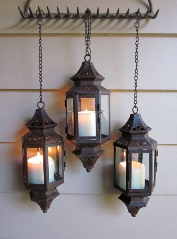 I love the idea of hanging a grouping of...who knows...from a rake head. Don't love these particular lanterns though.