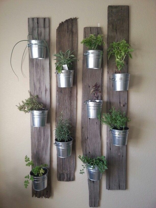 Creative Indoor Vertical Wall Gardens • Lots of Great Ideas and Tutorials! Including, this idea of small tin buckets attached to repurposed wood. Love this look!