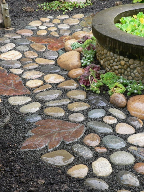 Garden path of rocks and the stepping stone made from a leaf mold.