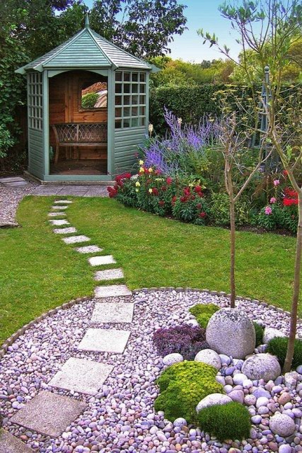 This garden design is stunning and simple. The gorgeous green seating area, the beautiful stone section and the perfectly laid out path - we love it!