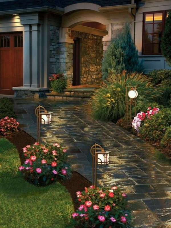 having a walkway to your door is great curb appeal. the lights add a nice touch at night. flowers along the pathway is also a great way to attract the eye to the pathway.