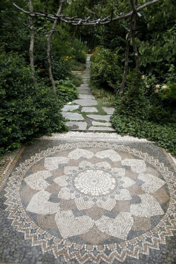 Beautiful mosaic garden rug with rustic arch pathway into woodland area - perfectly juxtaposed to enhance both.