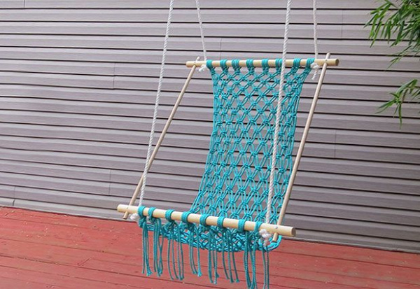Relax on your porch in a comfortable macrame hammock.